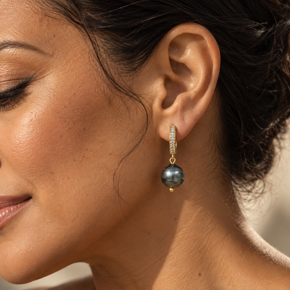 Close-up of Keiko Earrings featuring a Tahitian pearl, gold finish, and sparkling details, perfect for Pacific jewellery lovers.